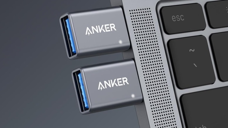 Two Anker USB-C to USB-A adapters connected to a MacBook