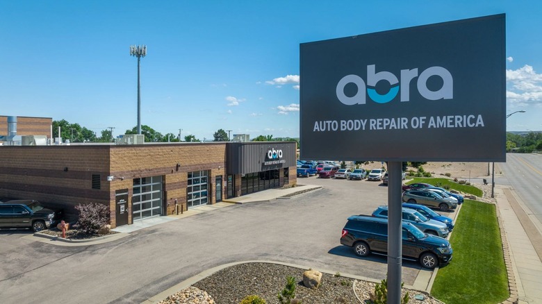 closeup of Abra auto body repair shop sign