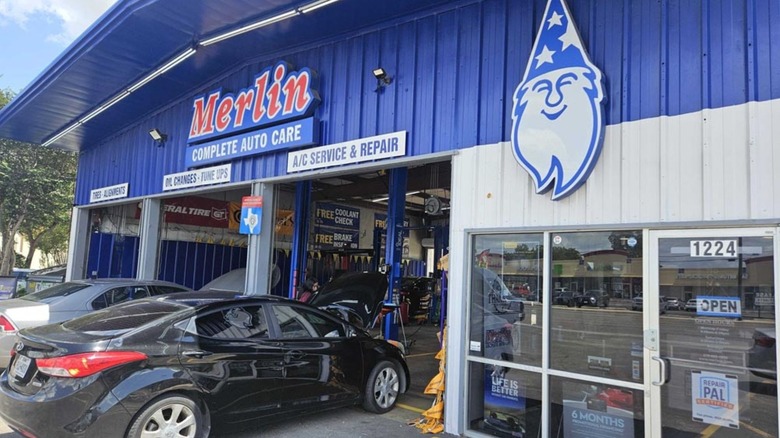 Merlin Complete Auto Care storefront with open garages