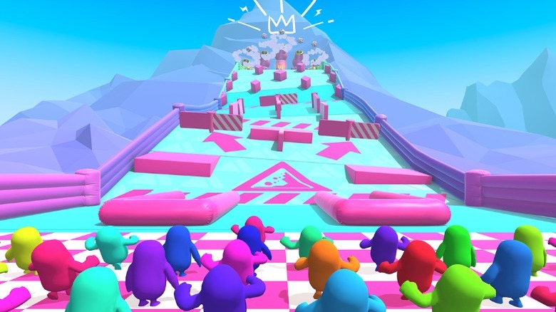 Fall Guys characters racing through course