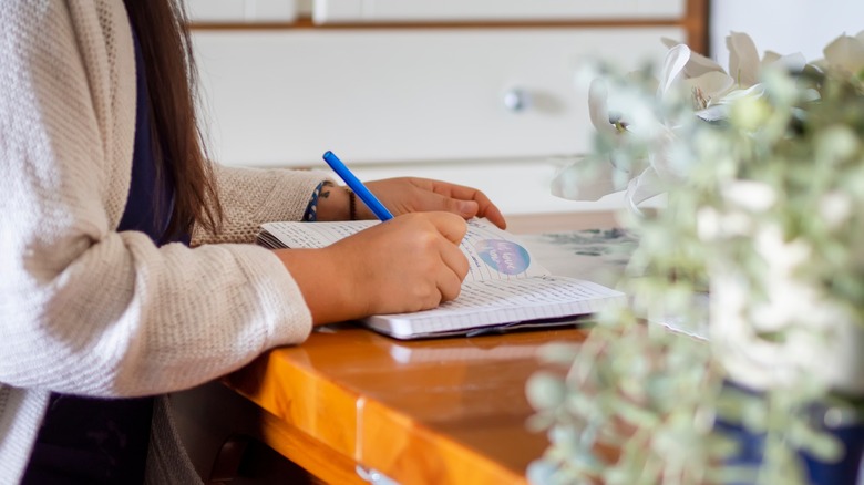 Woman writing a journal