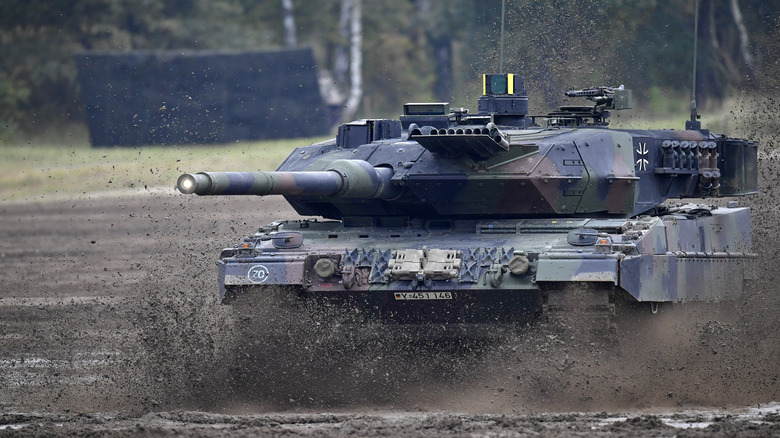 Leopard 2A7 Main Battle Tank driving through the mud