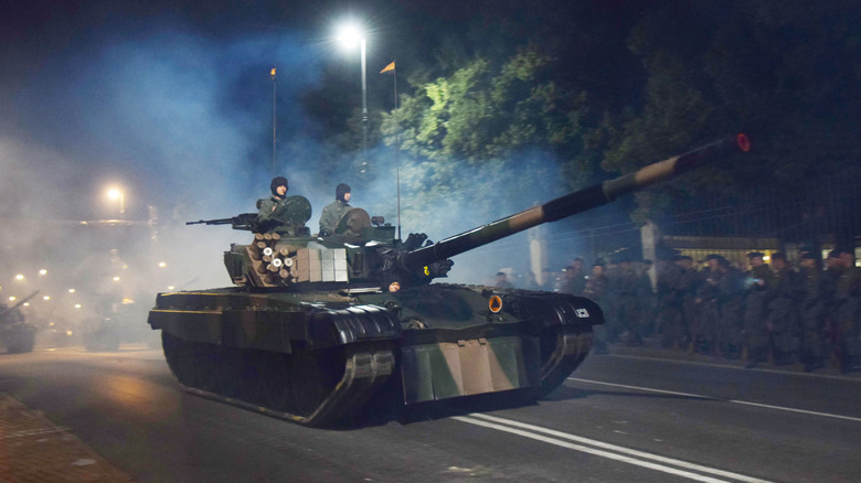 PT-91 Twardy battle tank during a night parade