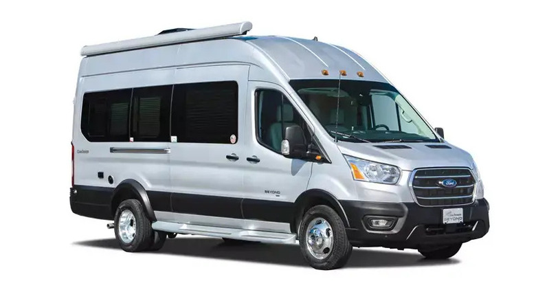 A silver 2025 Coachmen RV Beyond against a white studio background, front view visible