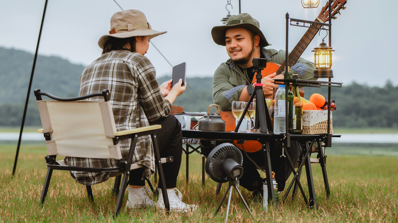 Hapy campers with their gadgets.