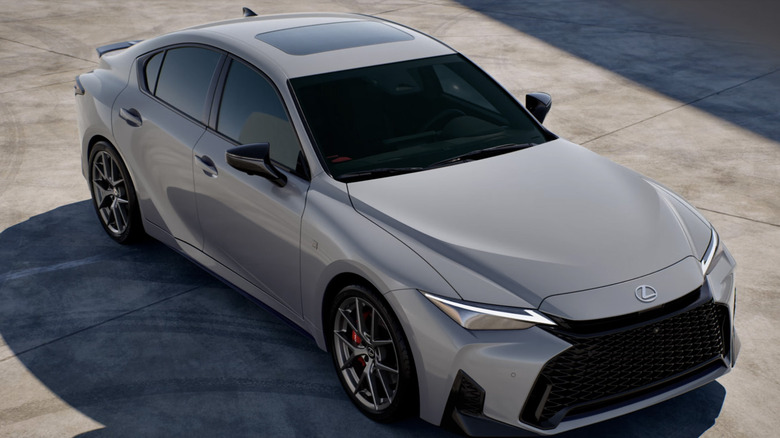 A white Lexus IS from a high angle, parked on concrete
