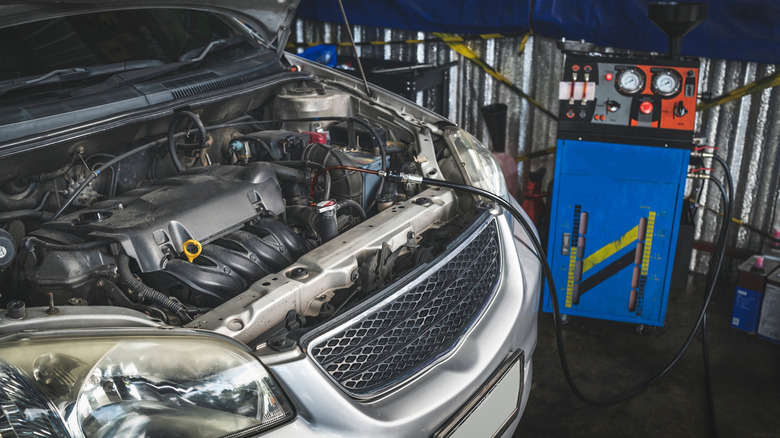 Mechanic performing a transmission flush service