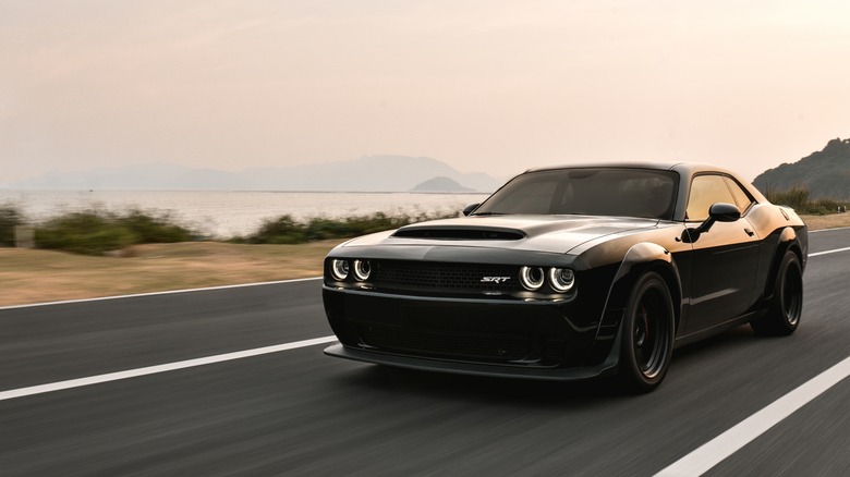 A Dodge Challenger on freeway near water