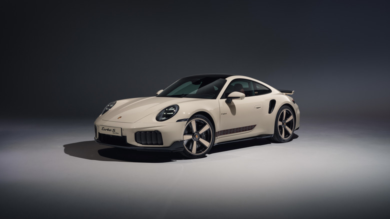 A Porsche 911 finished here in the special "Sadu Edition" trim and colorway standing against a studio background.