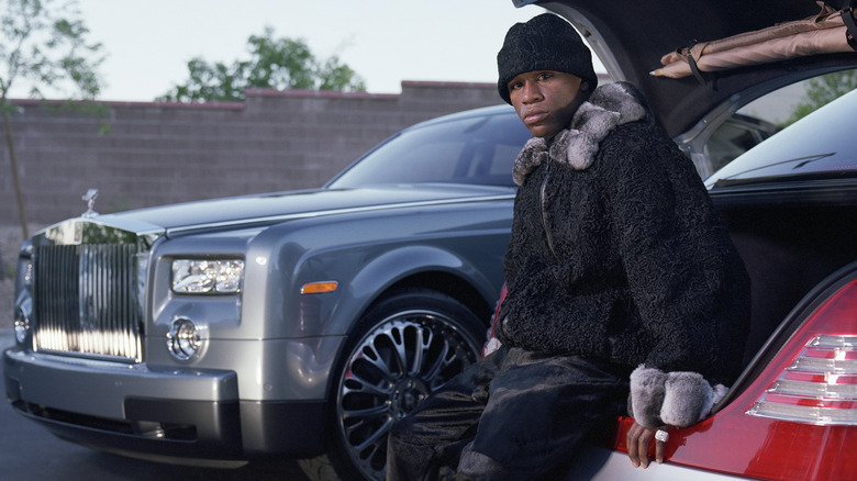 Floyd Mayweather pictured at home with a Rolls-Royce Phantom in 2004