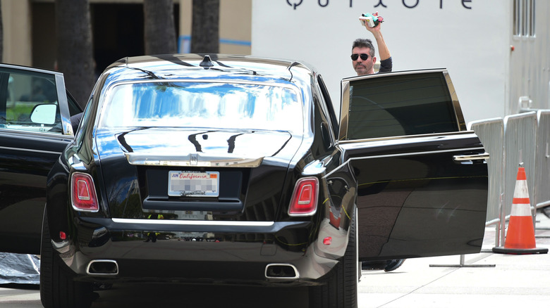 Simon Cowell gets into his Rolls-Royce Phantom