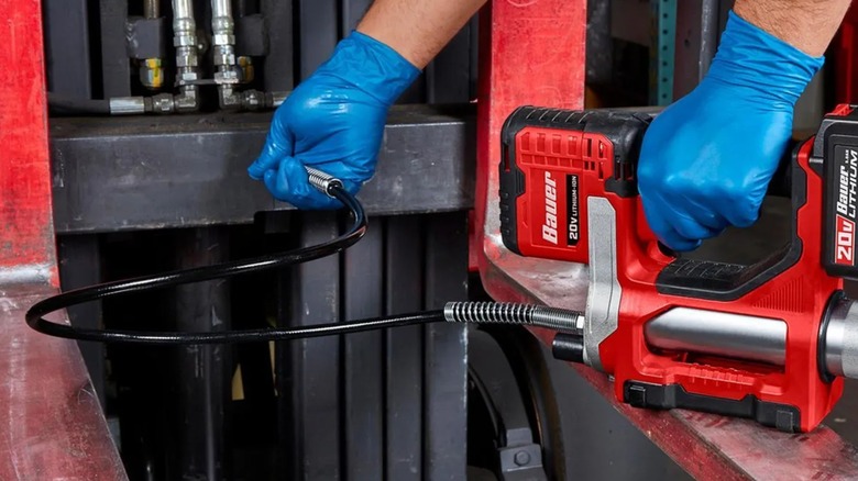 applying grease with Bauer greese gun