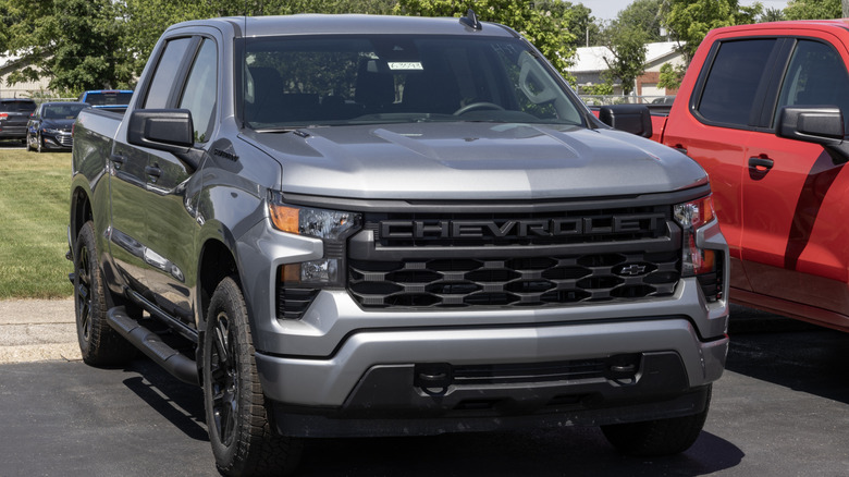 A grey Chevrolet Silverado 1500 in a parking lot