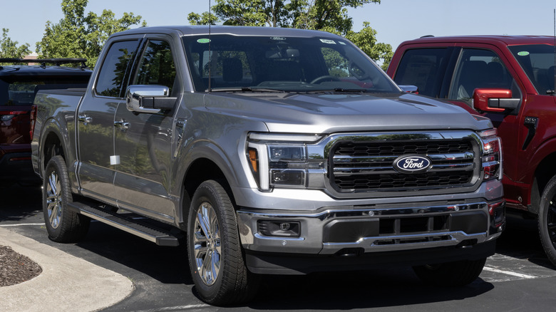 A silver Ford F-150 in a parking lot
