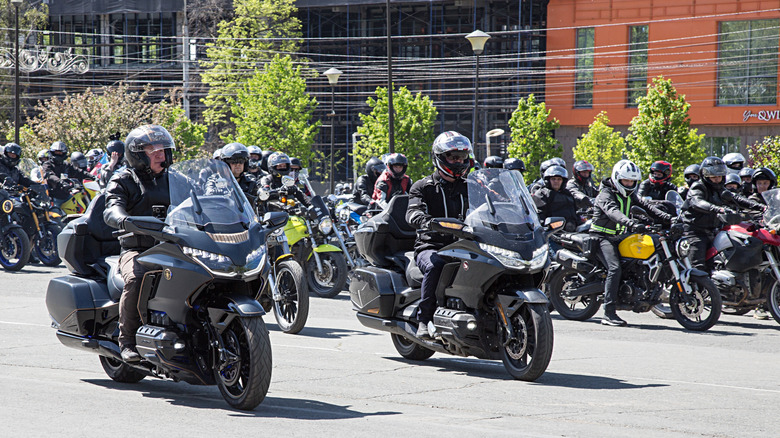 Two black Honda Gold Wing GL1800 touring motorbikes at the front of a bike parade.