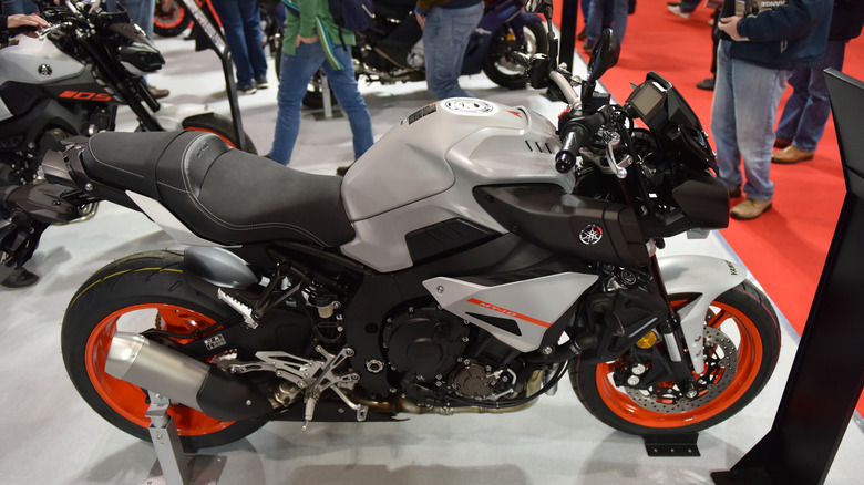 A Yamaha MT-10 at the exCEL show in London, finished in orange and gray.