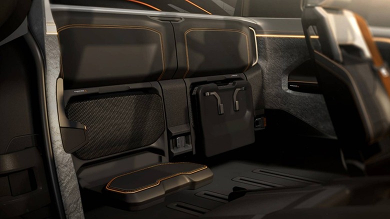 Interior of the Ram 1500 REV concept truck, showcasing a futuristic rear cabin with stowable jump seats.