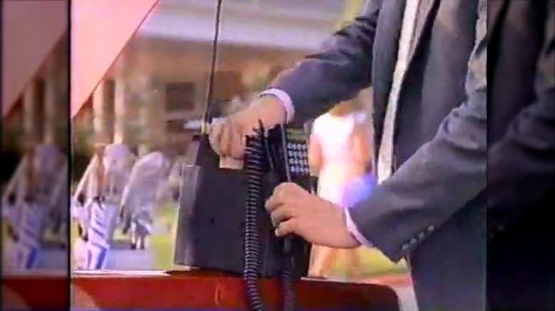A screenshot from a commercial for a Radio Shack "Go Anywhere" cellphone from 1990