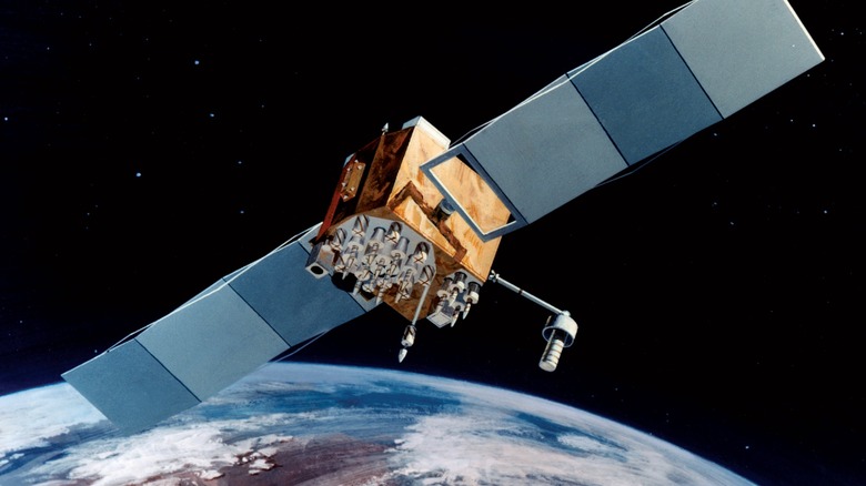 An artist's painting of the Navstar-2F satellite orbiting Earth