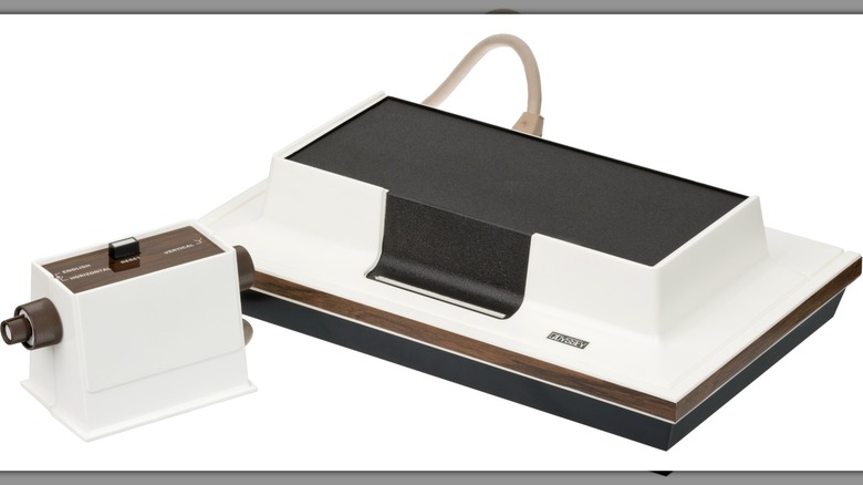 An original Magnavox Odyssey and one of its two accompanying game controllers