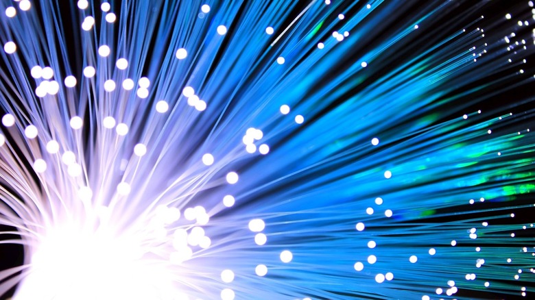 A bundle of fiber optic cable with white light shining through