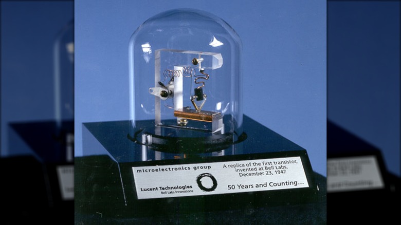 A replica of the world's first point-contact transistor inside a glass dome
