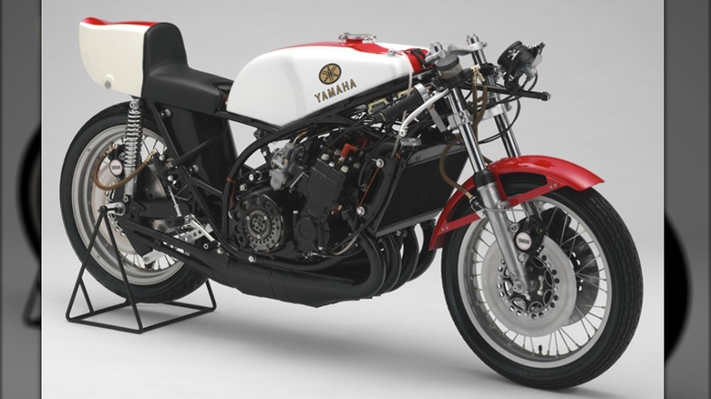 image of the Yamaha TZ750 in red, white, and black against a plain background.