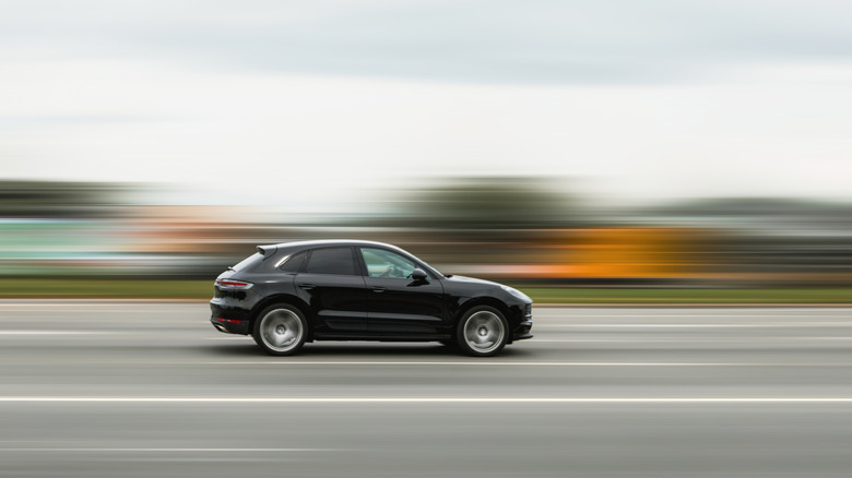 a car driving with the surroundings blurred