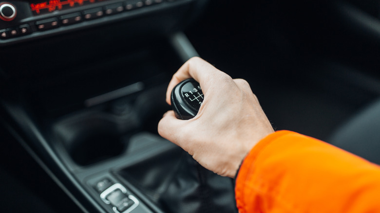 hand on a gear shifter