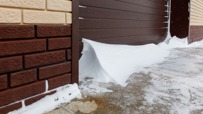Garage door covered in snow.