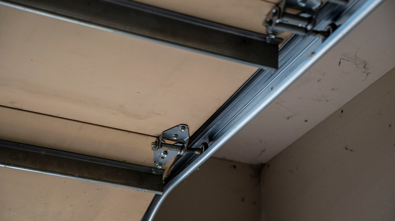 A garage door track on the ceiling.