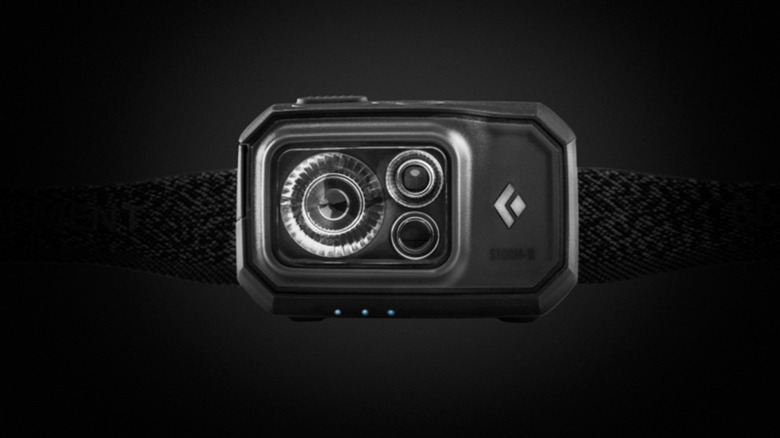 A Black Diamond headlamp against a dark background