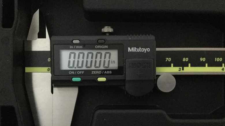 A Mitutoyo brand digital caliper showing a zero reading