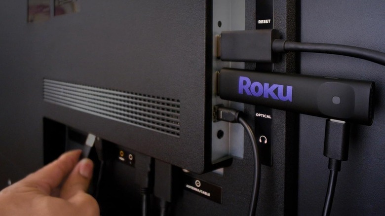 Roku Streaming Stick behind TV