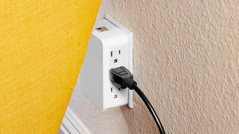 A Vanguard side entry tap behind a couch.