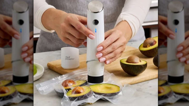 A Chef Preserve Vacuum Sealer lying on bags to be sealed