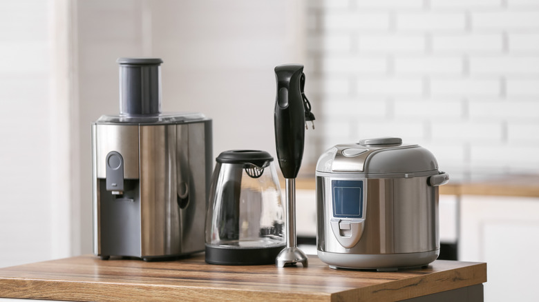 View of kitchen appliances sitting on a wooden countertop