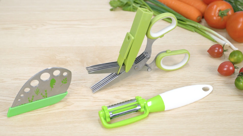 A herb stripper stripping stems into waiting bowls and baskets