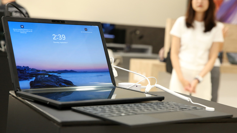 An Asus Zenbook 17 Fold in its "L" shaped configuration, sitting on a desk with the keyboard detached.