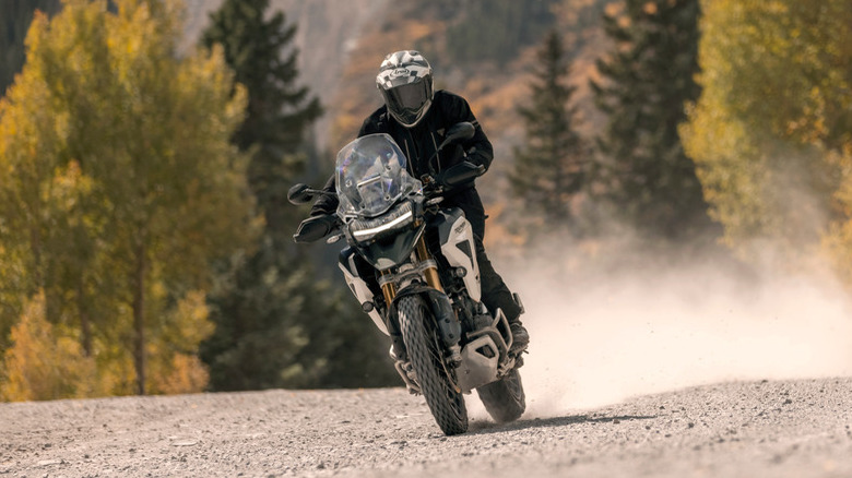 Triumph Tiger 1200 Rally Pro riding on dirt