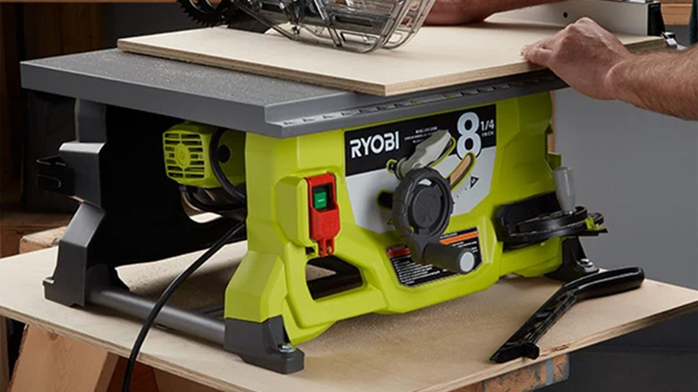 A Ryobi table saw on a work surface.