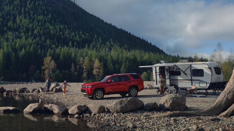 A toyota 4-runnner beside a lake