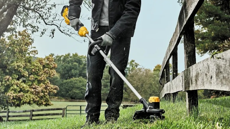 using the DeWalt string trimmer near a fence