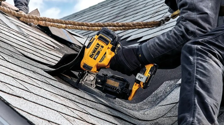 roofers installing a new roof with DeWalt nailer
