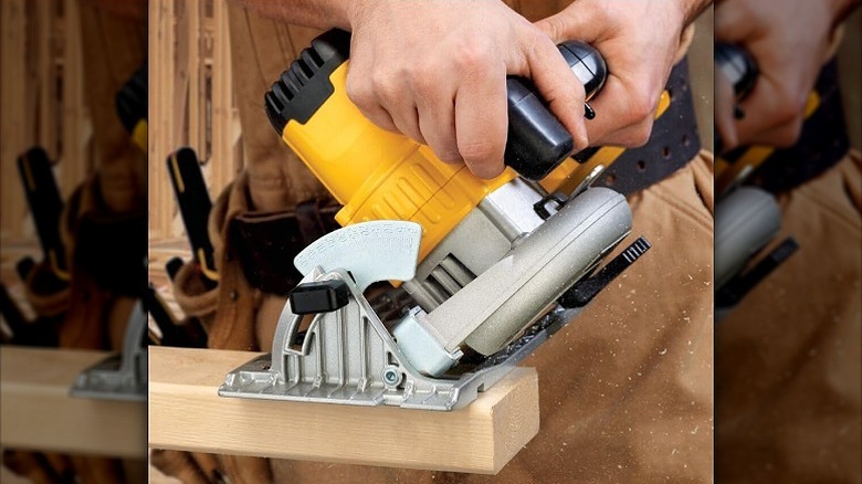 Using circular saw on a wooden bar
