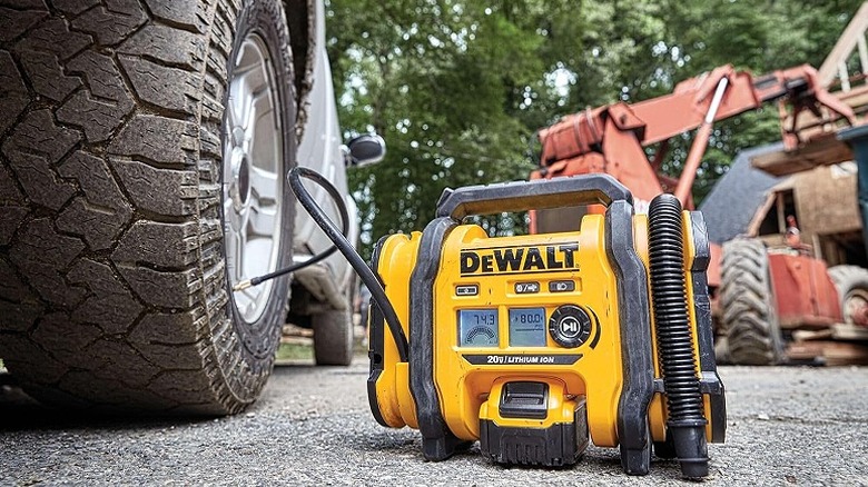 DeWalt tire inflator inflating a car's tire