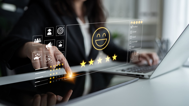 Holographic images of a happy emoji and give star ratings