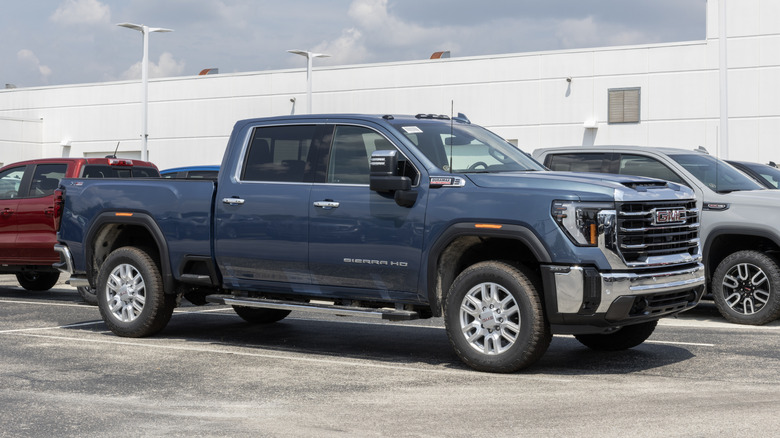 A matte blue GMC Sierra 2500 Heavy Duty on display to the public.