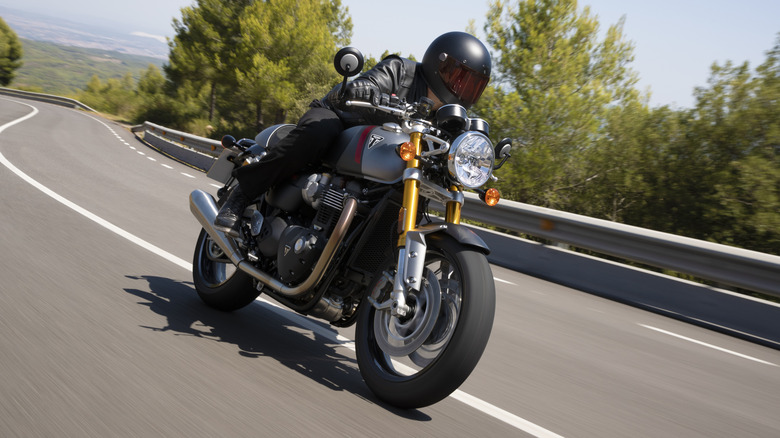 A Triumph Thruxton RS being driven down the highway.