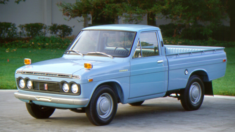 Toyota Hi-Lux Pickup Truck parked in front of a lawn